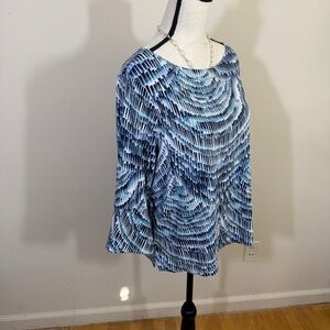 Chico’s jersey knit top in different shades of blue. Nearly new. 3/4 sleeves.